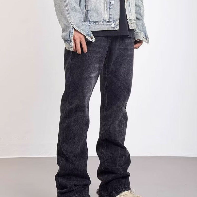 Udsvajede herrejeans med vasket effekt og slidte detaljer
