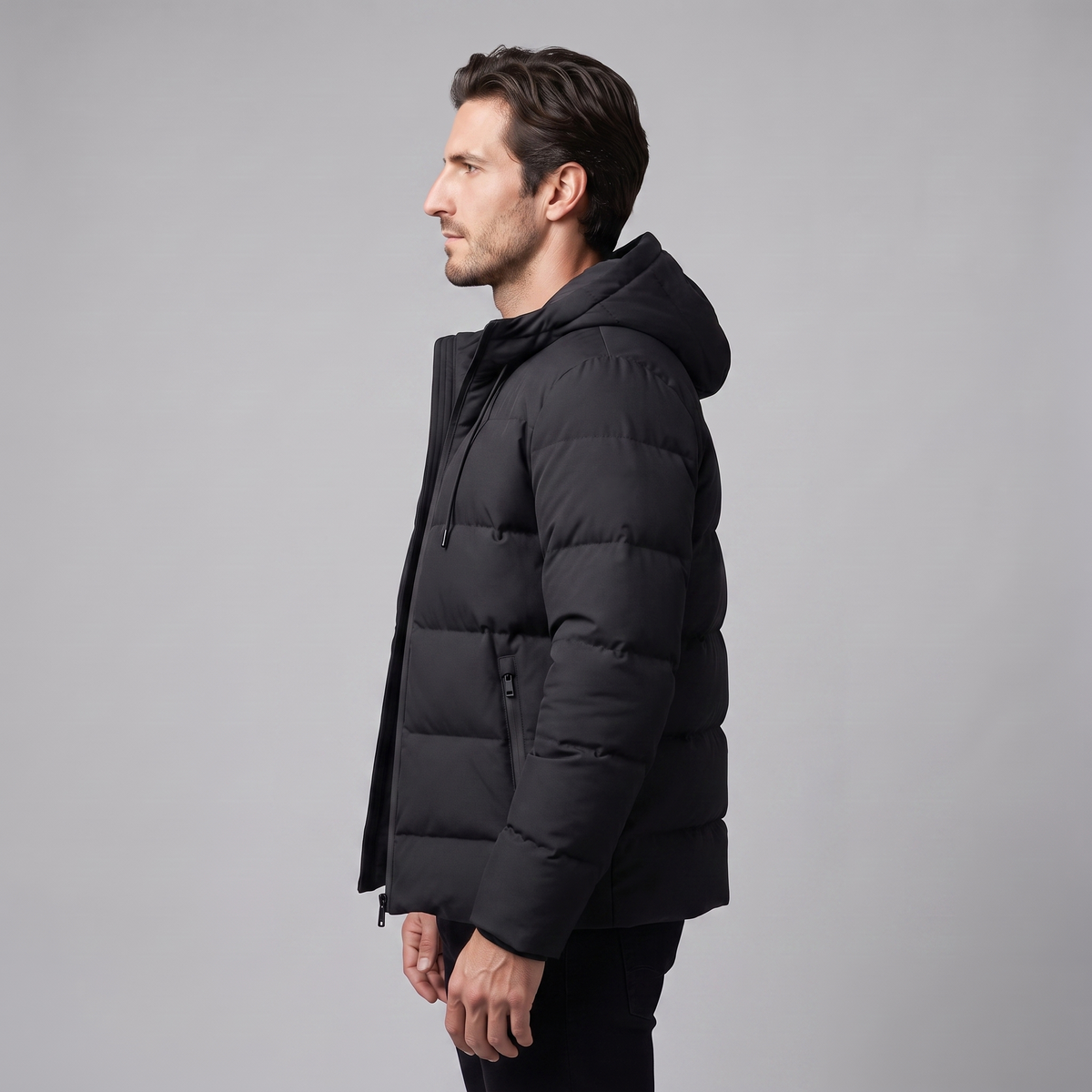 Men's winter jacket with a hood, quilted padding, and polyester insulation.