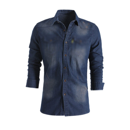 Men's solid-color denim shirt with textured fabric, chest pockets, and long sleeves.