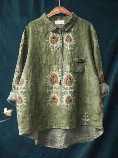 Camicia verde lino con motivi floreali, maniche lunghe, colletto classico e taschino. Design elegante e casual, ideale per moda autunnale.