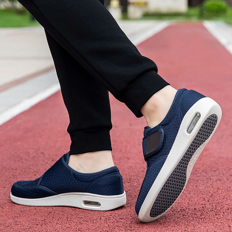 Men's breathable mesh walking shoes with adjustable Velcro strap and cushioned sole.
