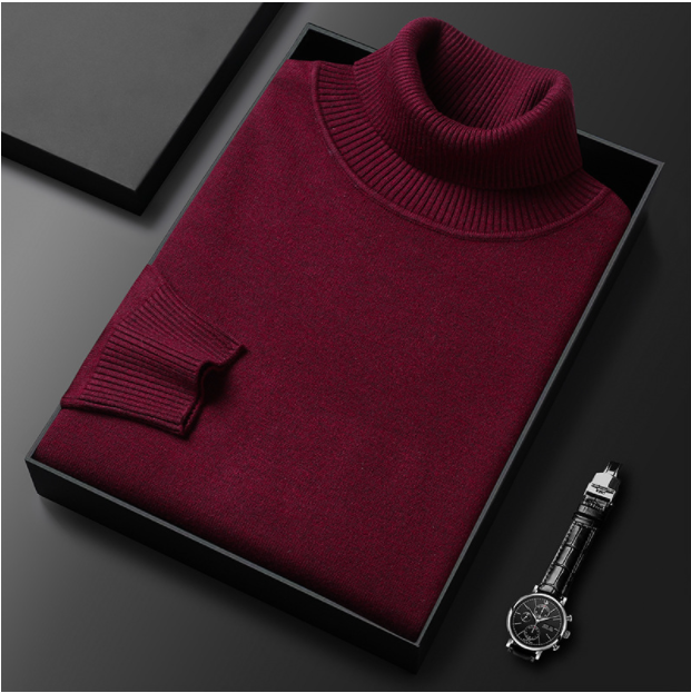 Maglione dolcevita bordeaux piegato in scatola nera su sfondo grigio, accanto a orologio da polso elegante. Moda uomo, abbigliamento invernale.