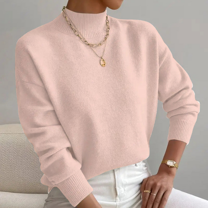 Women's cashmere turtleneck sweater with a straight fit and ribbed trims.