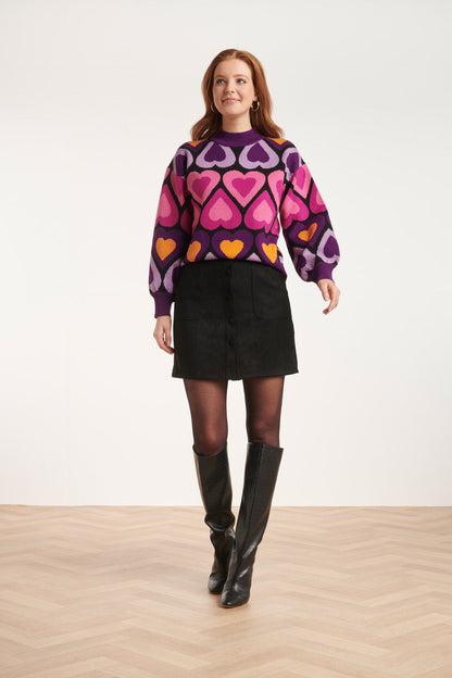 Oversize damebluse med hjerteprint og høj ribkrave