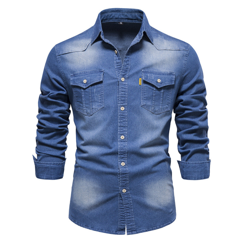 Men's solid-color denim shirt with textured fabric, chest pockets, and long sleeves.