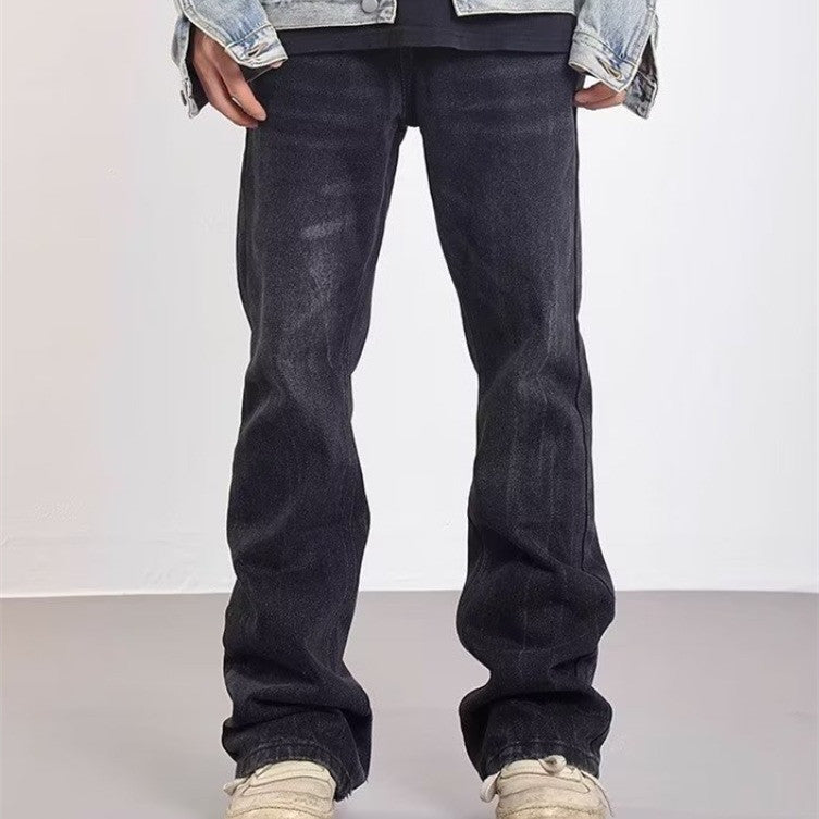 Udsvajede herrejeans med vasket effekt og slidte detaljer