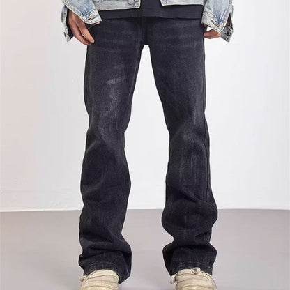 Udsvajede herrejeans med vasket effekt og slidte detaljer