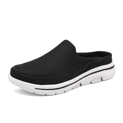 Scarpa slip-on nera da uomo con suola bianca, design casual e traspirante, ideale per passeggiate e tempo libero. Scarpe comode e leggere.
