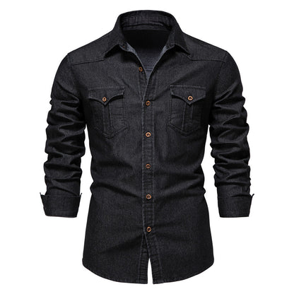Men's solid-color denim shirt with textured fabric, chest pockets, and long sleeves.