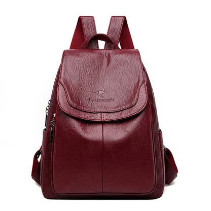 Zaino in pelle rosso bordeaux, design elegante con tasche multiple e chiusura a zip, ideale per scuola o lavoro. Accessorio moda versatile.