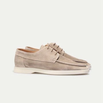 Men’s suede-style boat shoes with laces, moccasin stitching, and a thick contrasting sole.