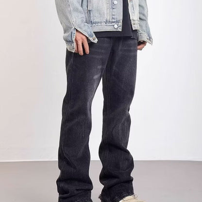 Udsvajede herrejeans med vasket effekt og slidte detaljer