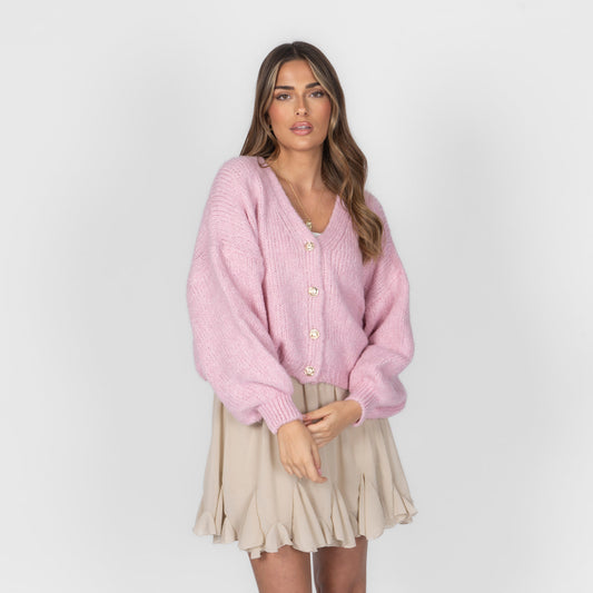 Women's oversized V-neck cardigan with button closure and a cropped length.