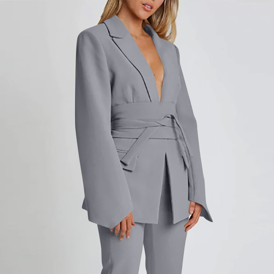 Women's autumn blazer with a belt and long bell sleeves.