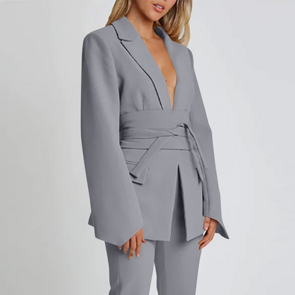 Women's autumn blazer with a belt and long bell sleeves.