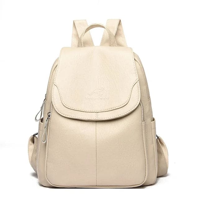 Zaino in pelle beige elegante con tasche laterali e chiusura a zip, ideale per scuola o lavoro. Design moderno e pratico per donne.