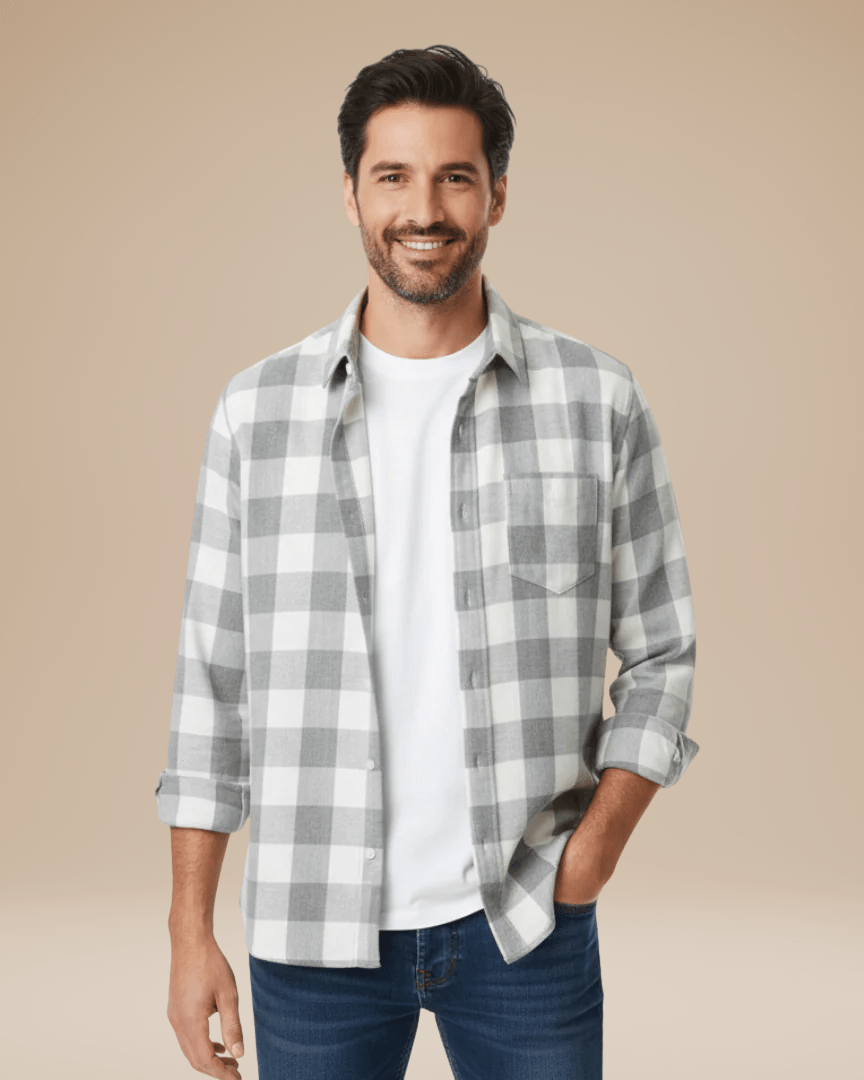 Camisa de hombre a cuadros con botones, corte cómodo, cuello con solapas y mangas largas.