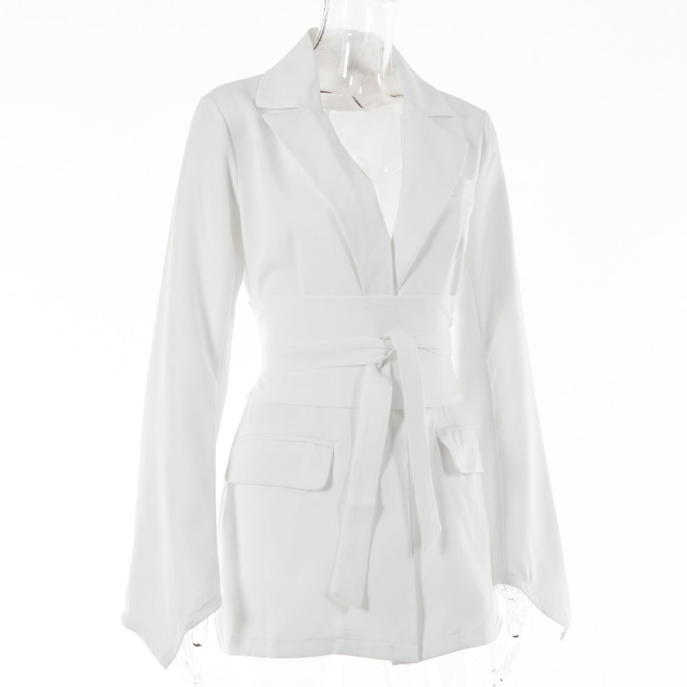 Women's autumn blazer with a belt and long bell sleeves.