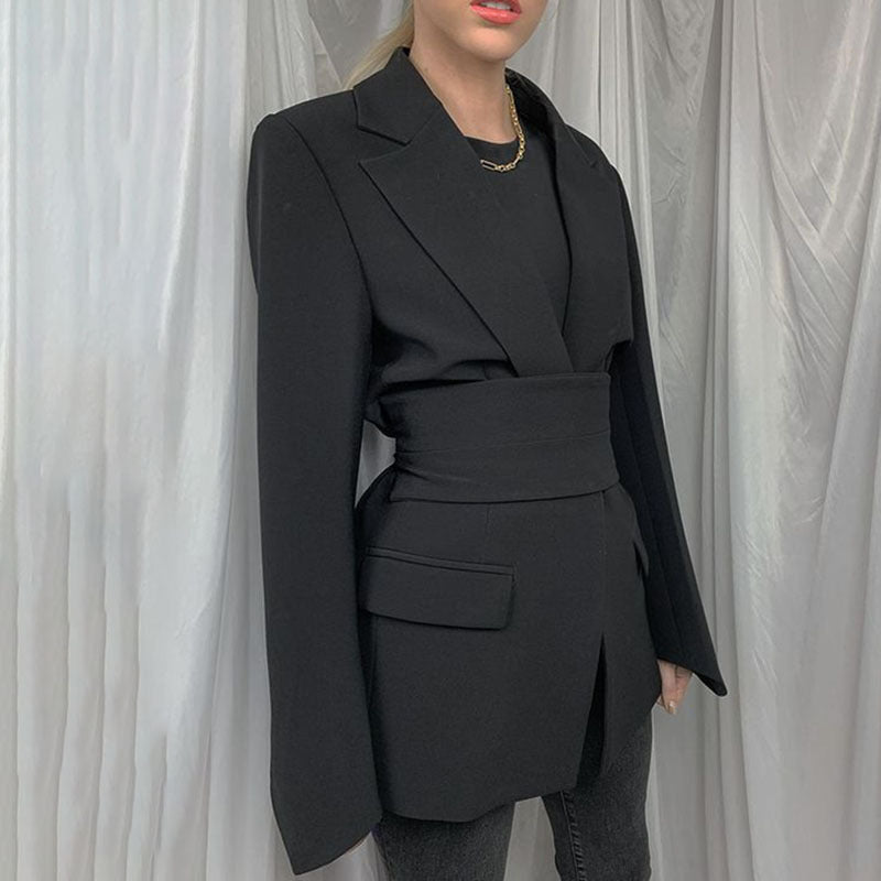 Women's autumn blazer with a belt and long bell sleeves.