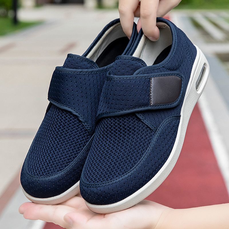 Men's breathable mesh walking shoes with adjustable Velcro strap and cushioned sole.