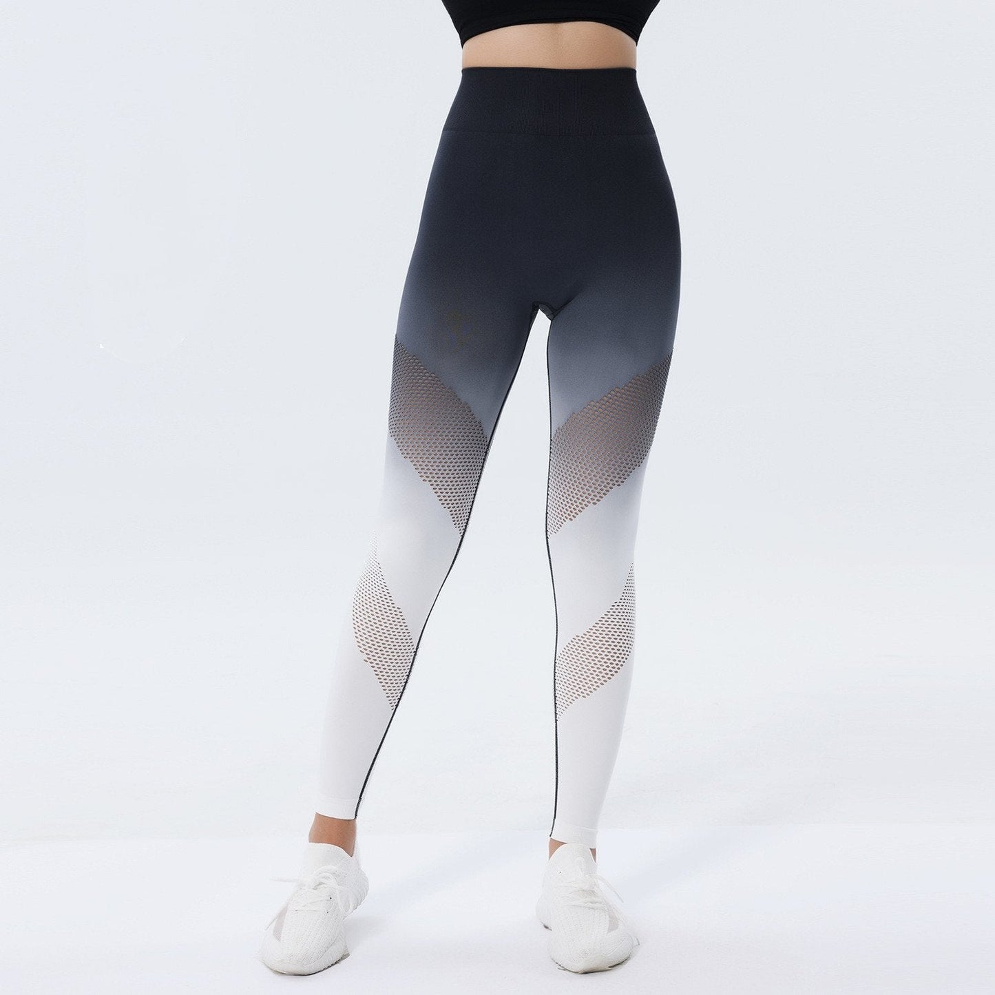Leggings sportivi donna a vita alta, sfumati nero e bianco, con dettagli a rete. Ideali per yoga, fitness e palestra. Design moderno e traspirante.