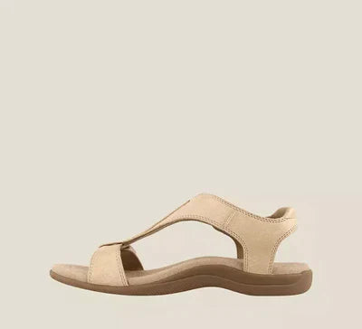 Sandalo beige da donna con suola ergonomica, design minimalista e cinturino regolabile. Calzatura estiva comoda e alla moda.