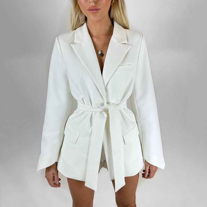 Women's autumn blazer with a belt and long bell sleeves.