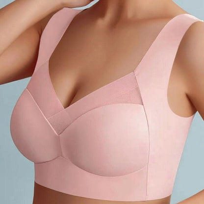 Reggiseno rosa senza cuciture, design a V, spalline larghe, tessuto morbido e traspirante, supporto confortevole, intimo donna elegante.