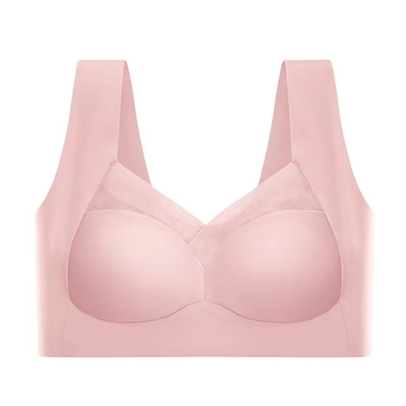 Reggiseno sportivo rosa senza cuciture, design confortevole e traspirante, ideale per attività fisica e supporto quotidiano.