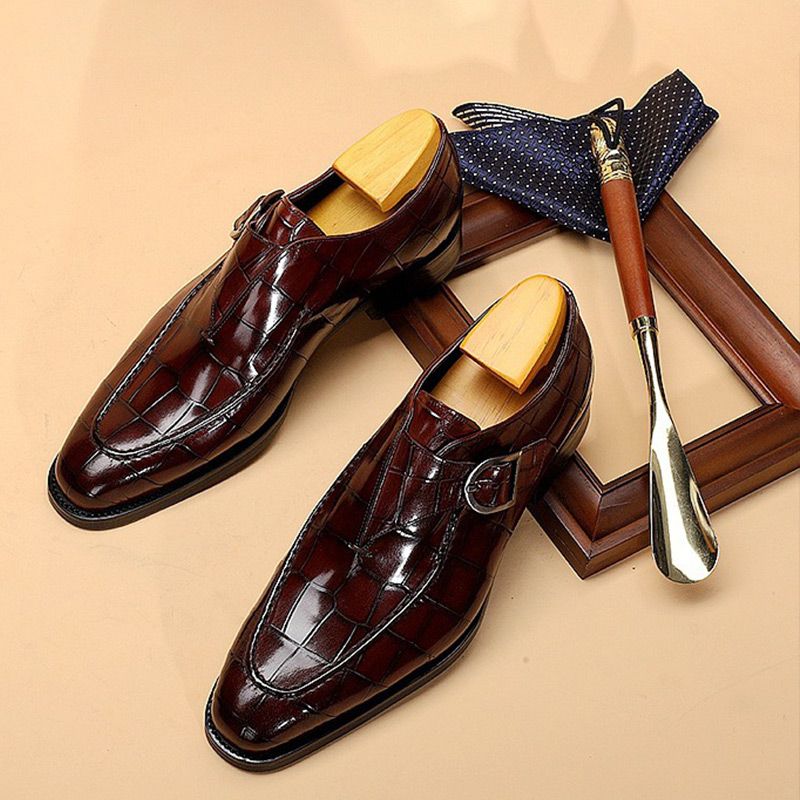 Men's elegant square-toe shoes with an adjustable strap and rubber sole.
