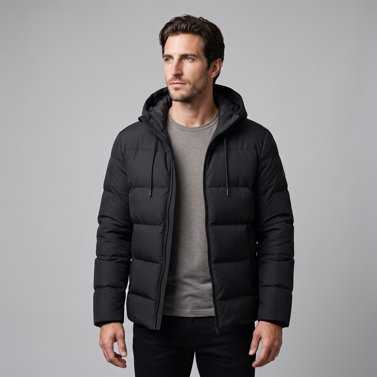 Men's winter jacket with a hood, quilted padding, and polyester insulation.