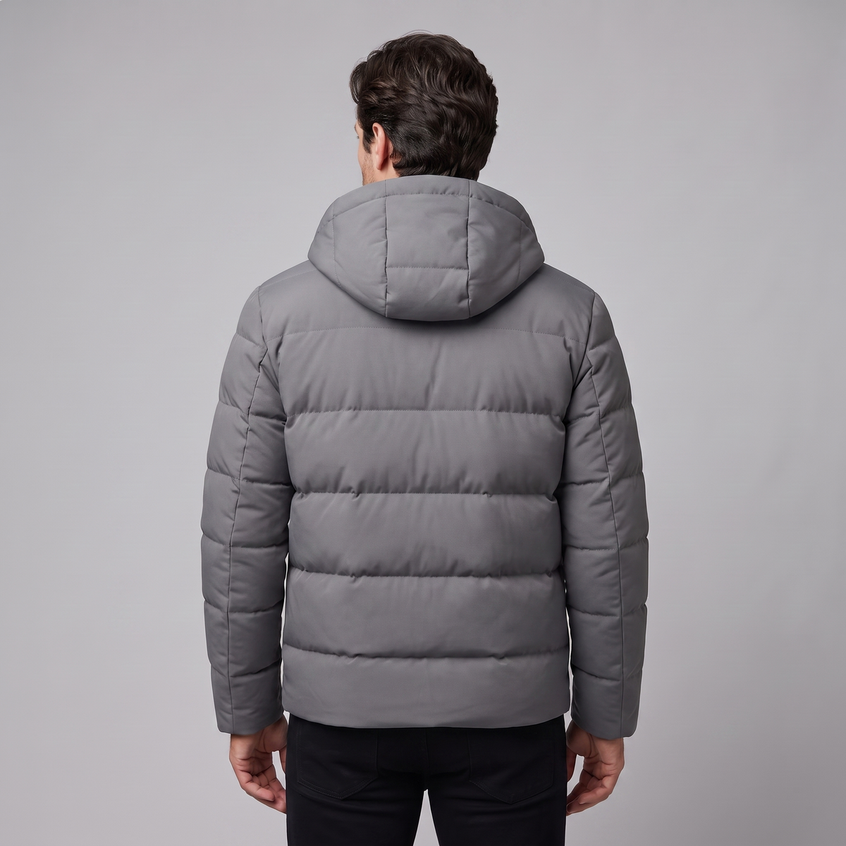 Men's winter jacket with a hood, quilted padding, and polyester insulation.