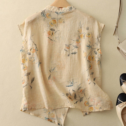 Damebluse med koreansk krave, blomsterprint og knapper i siden