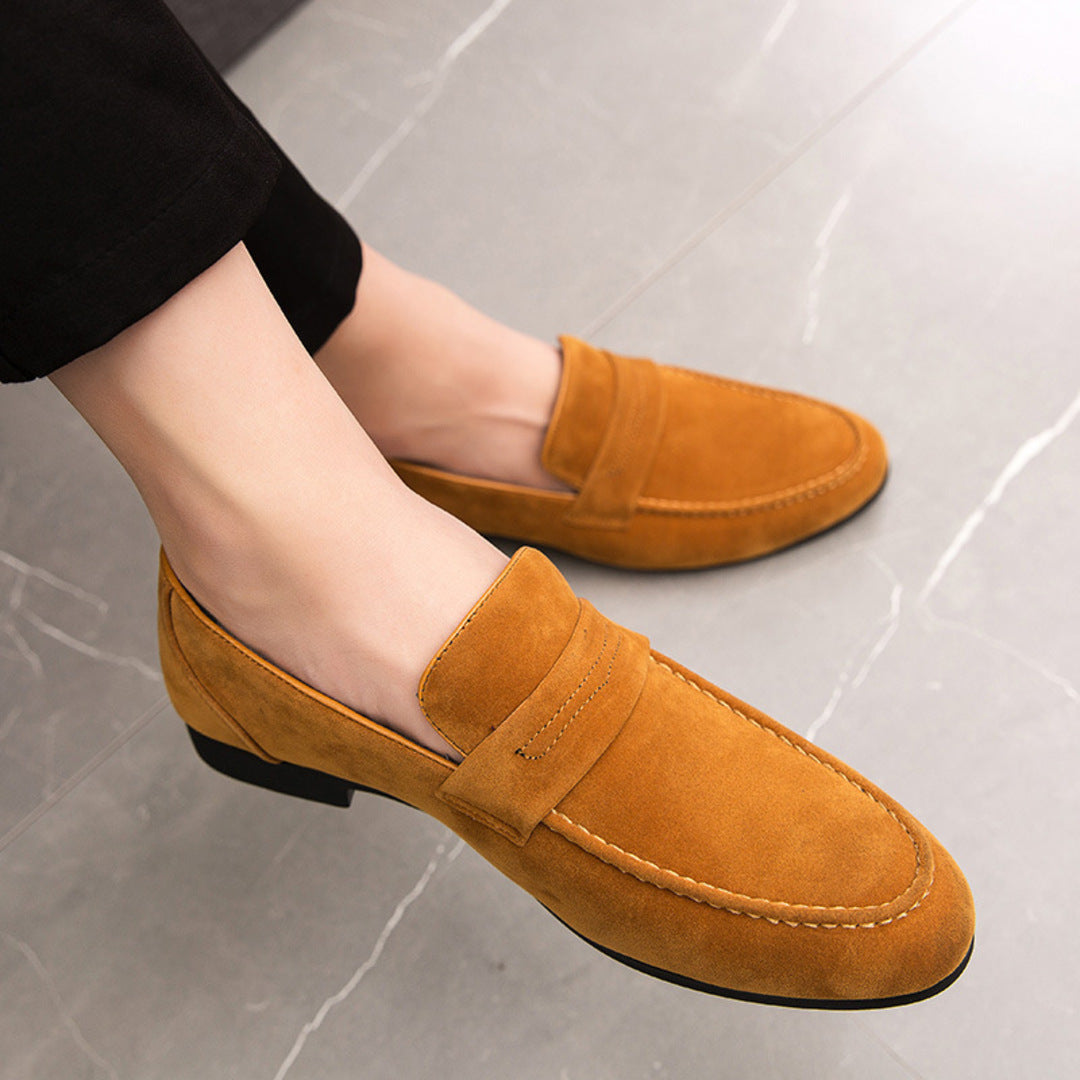 Men’s suede loafers with a minimalist design and padded insole.