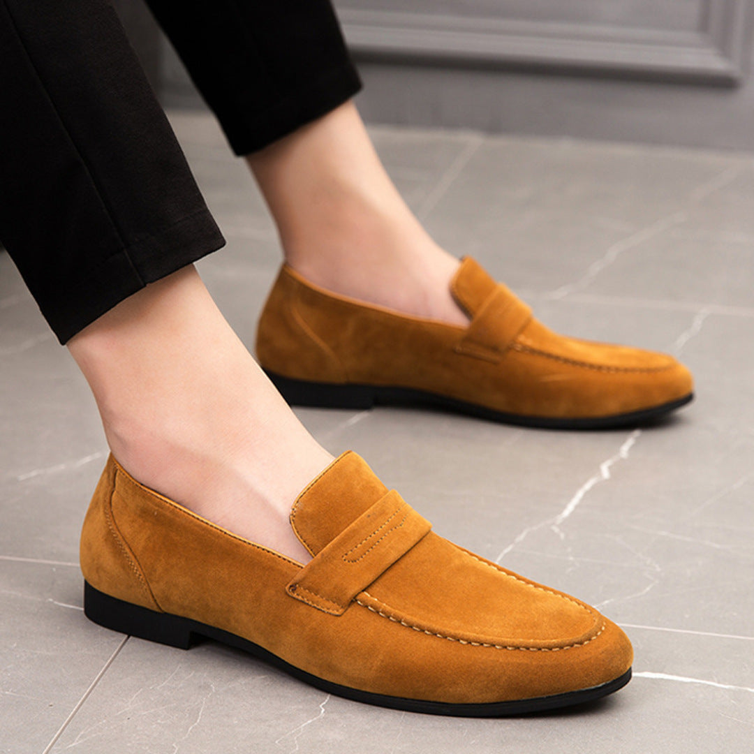 Men’s suede loafers with a minimalist design and padded insole.
