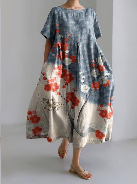 Abito lungo estivo in lino con stampa floreale rossa e blu, design ampio e comodo, perfetto per look casual e boho chic.
