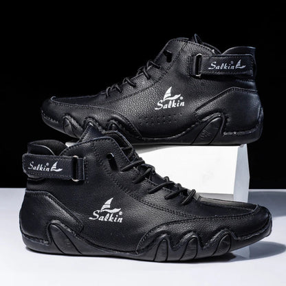 Scarpe da ginnastica alte nere in pelle, design moderno con logo "Salkin", suola robusta, adatte per sport e moda urbana.