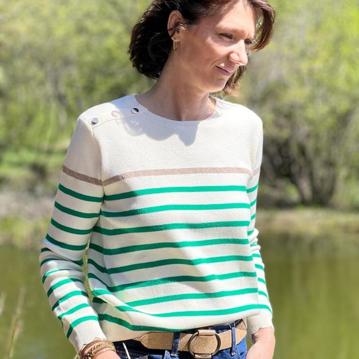 Women's striped knit sweater with a crew neck and shoulder buttons