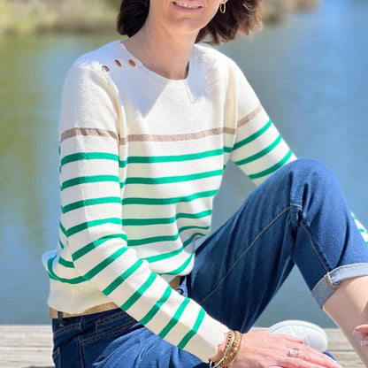 Women's striped knit sweater with a crew neck and shoulder buttons
