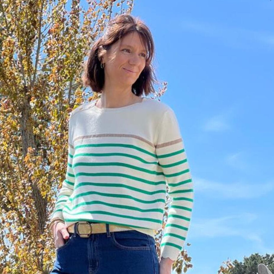 Women's striped knit sweater with a crew neck and shoulder buttons