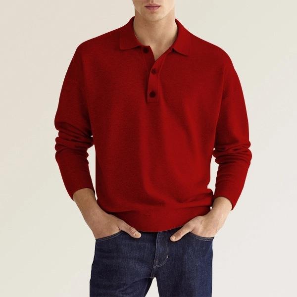 Uomo con maglione rosso a maniche lunghe e jeans blu. Moda casual maschile, abbigliamento autunnale, stile elegante e moderno.