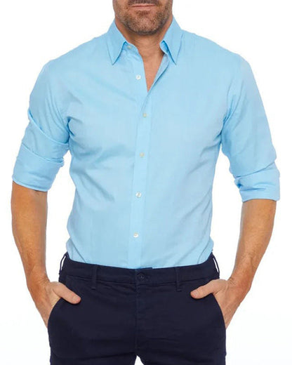 Camisa Oxford de hombre de corte ajustado con cremallera frontal, botones decorativos y mangas largas.