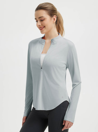 Damebluse med lange ærmer, afrundet kant, tommelhuller