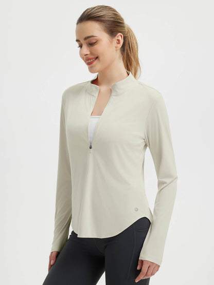 Damebluse med lange ærmer, afrundet kant, tommelhuller