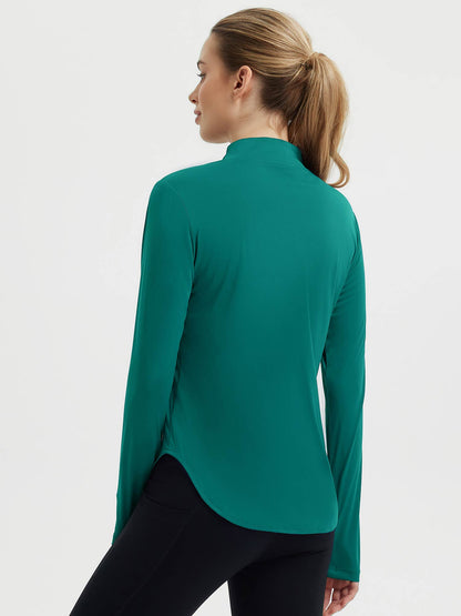 Damebluse med lange ærmer, afrundet kant, tommelhuller