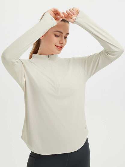 Damebluse med lange ærmer, afrundet kant, tommelhuller