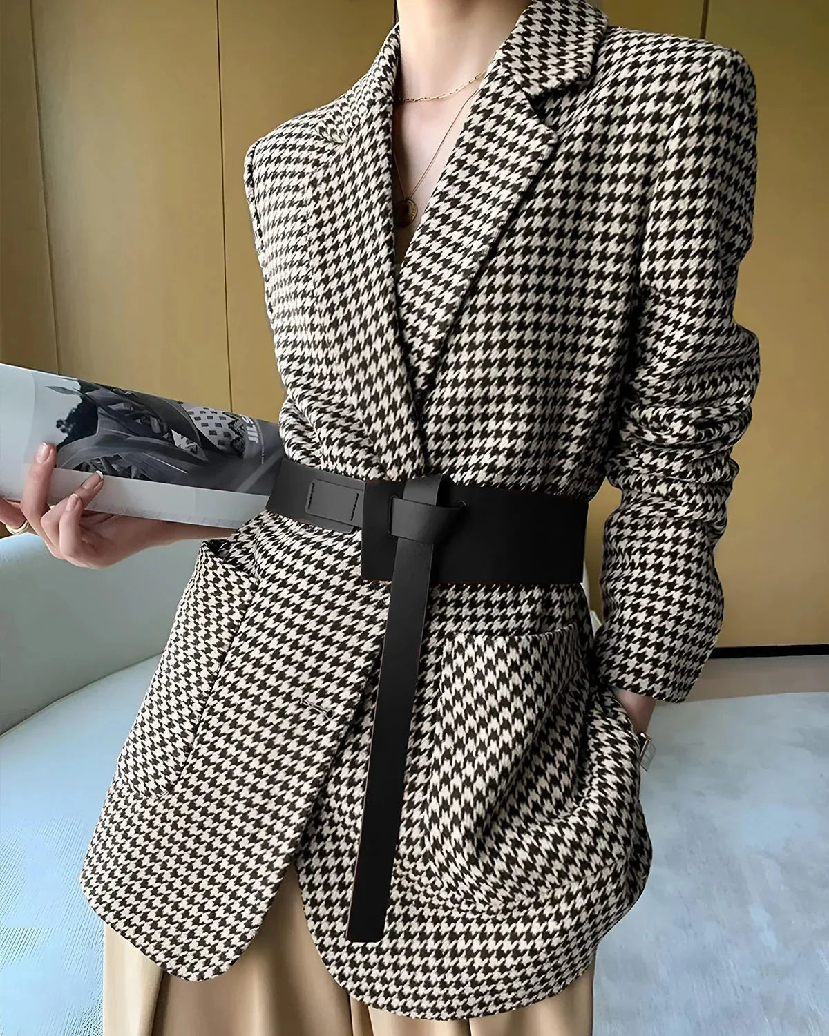 Women's fall blazer with a houndstooth print, adjustable belt, and slit