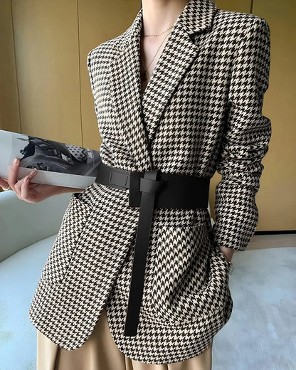 Women's fall blazer with a houndstooth print, adjustable belt, and slit