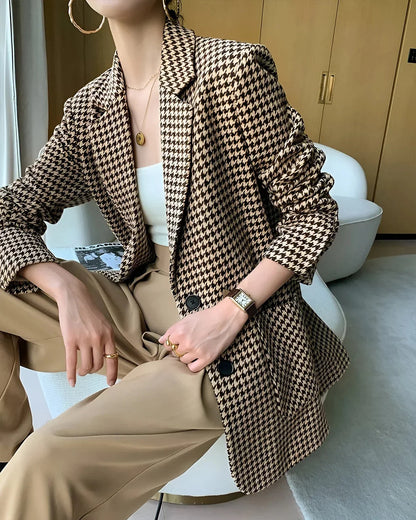 Women's fall blazer with a houndstooth print, adjustable belt, and slit