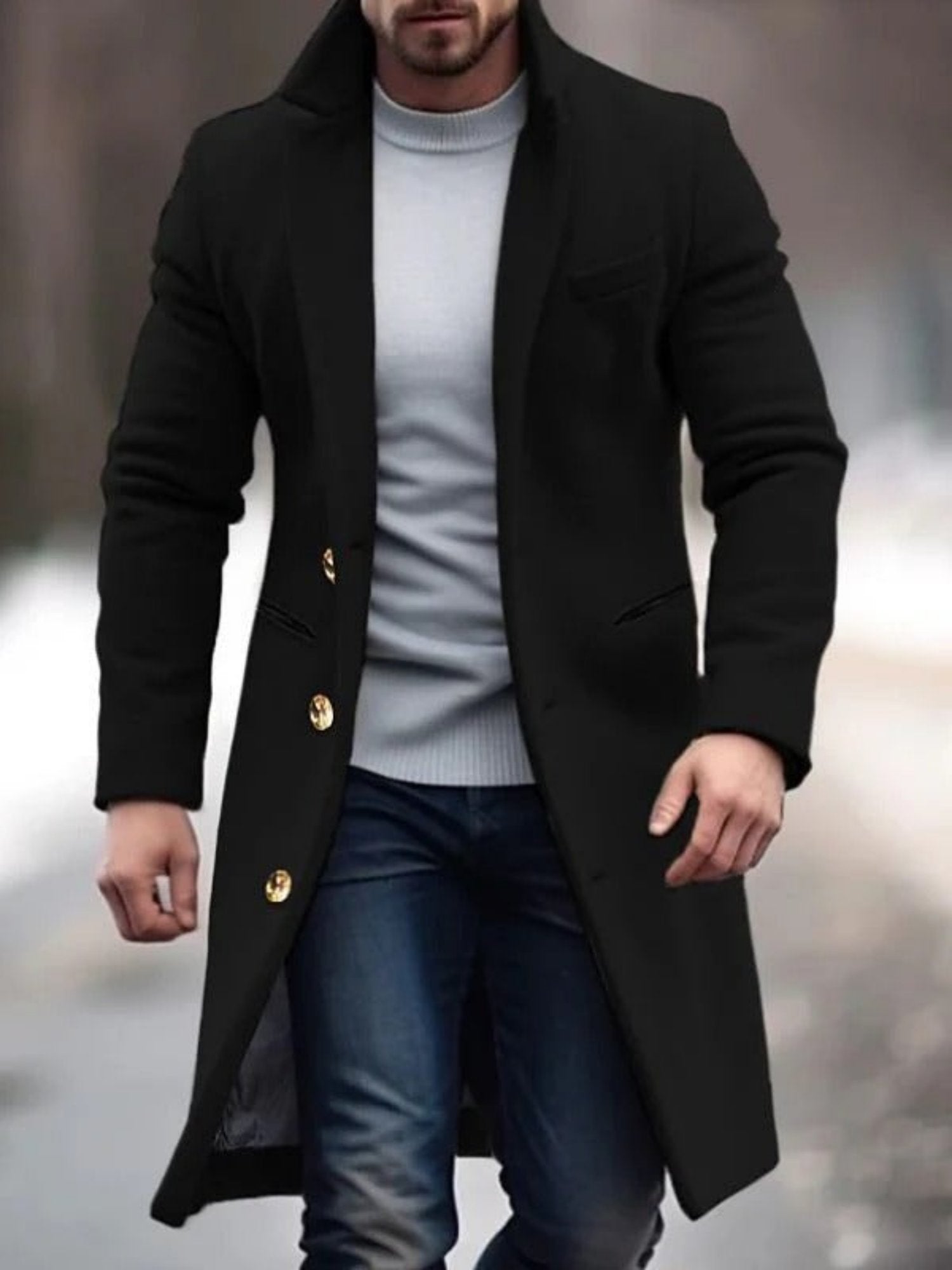 Cappotto nero elegante da uomo con bottoni dorati, indossato su maglione grigio e jeans. Moda invernale maschile, stile casual chic.